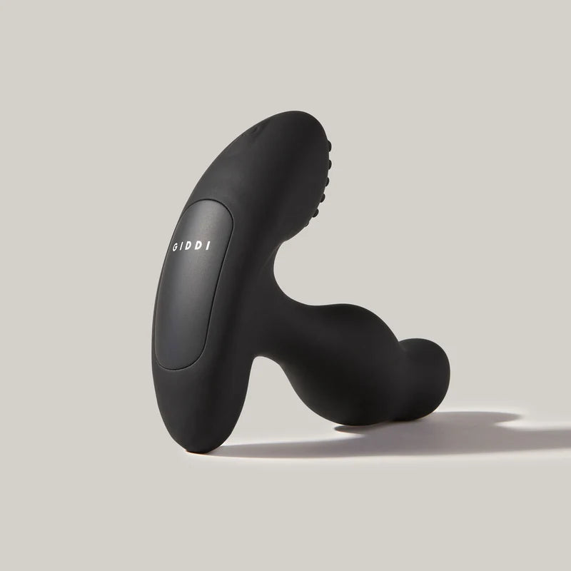 giddi thor rotating prostate massager standing on back with bottom logo on neutral background