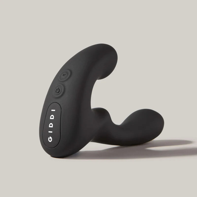 Black Giddi controller on a light gray background